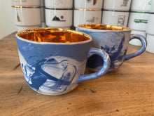 Load image into Gallery viewer, Graphic Blue mug decorated with gold